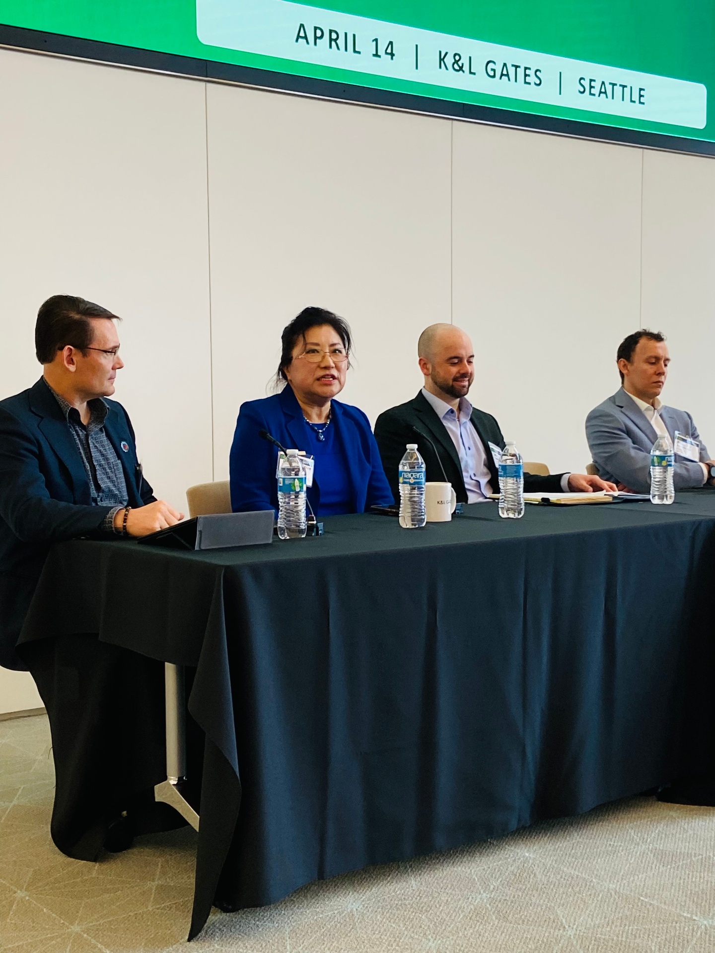 Panelists speaking during a session at Northwest Quantum Day at K&L Gates in Seattle.